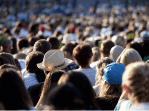 An image of a crowd of people facing away